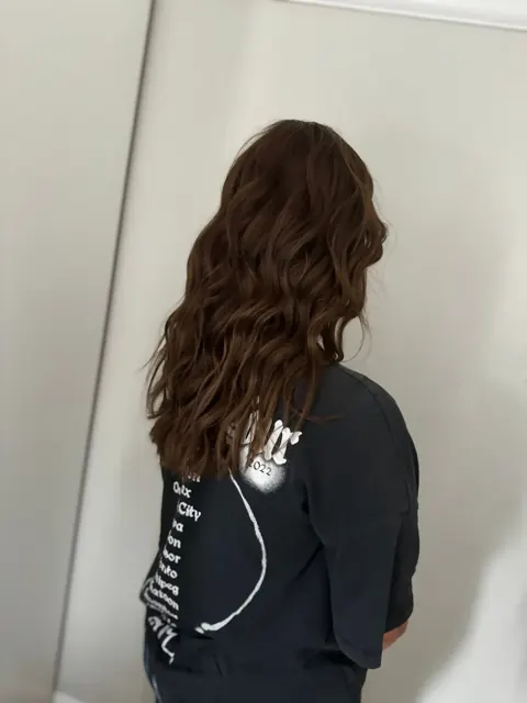 Long dark waves viewed from behind