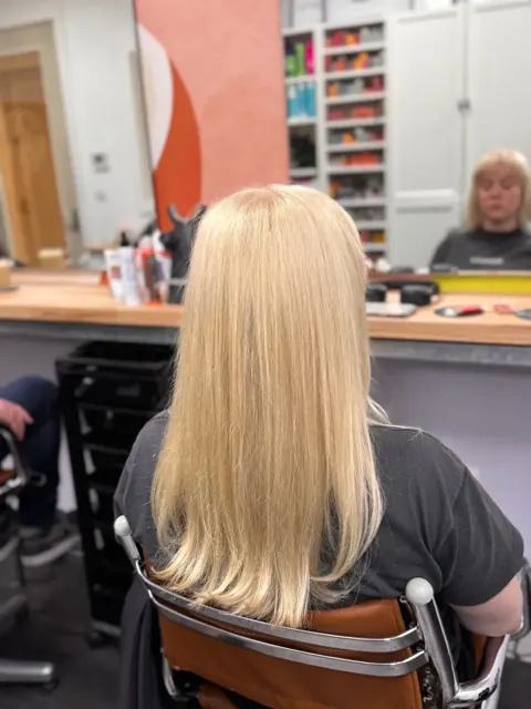 Long straight blonde hair viewed from behind